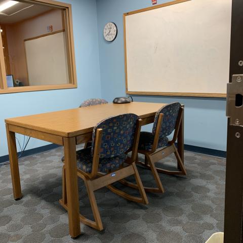 Study Room C table, chairs, and white board