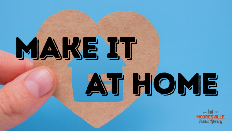 Hand holds paper heart with a house silhouette cutout. Text reads make it at home. Mooresville Public Library logo